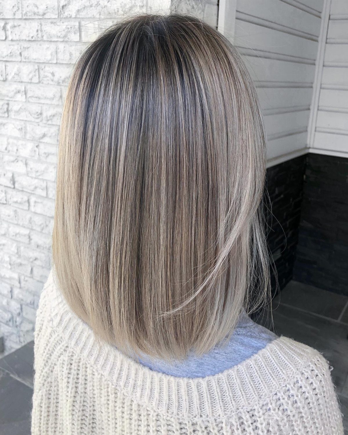 Straight light ash blonde bob with smoky darker lowlights and roots