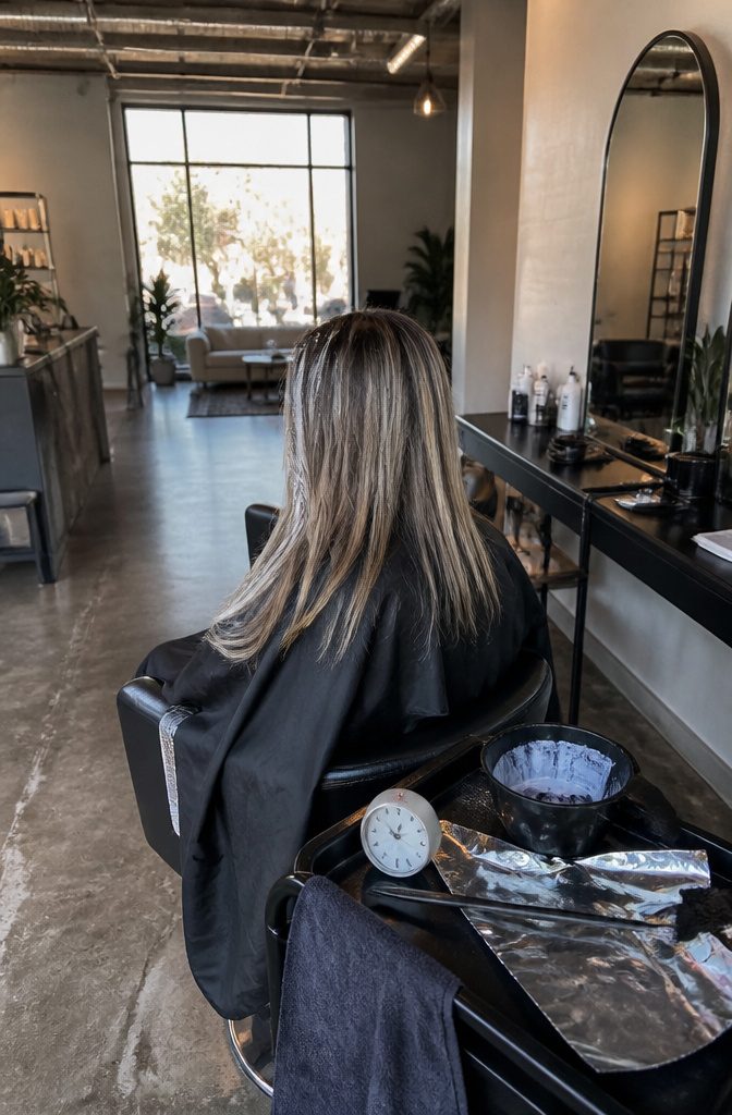 Blonde highlights cooled to ash against darker strands