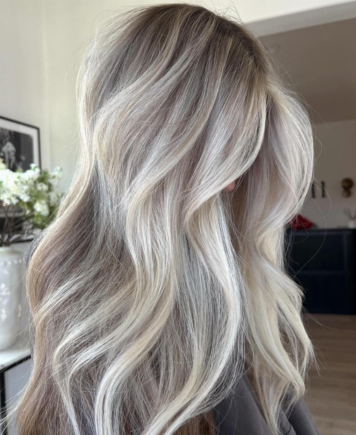 Long wavy ash-blonde hair with icy pale balayage ribbons