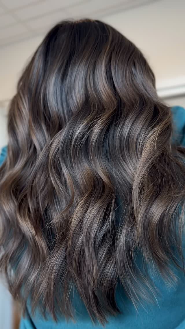 Long dark brown waves with soft, lighter brunette lines