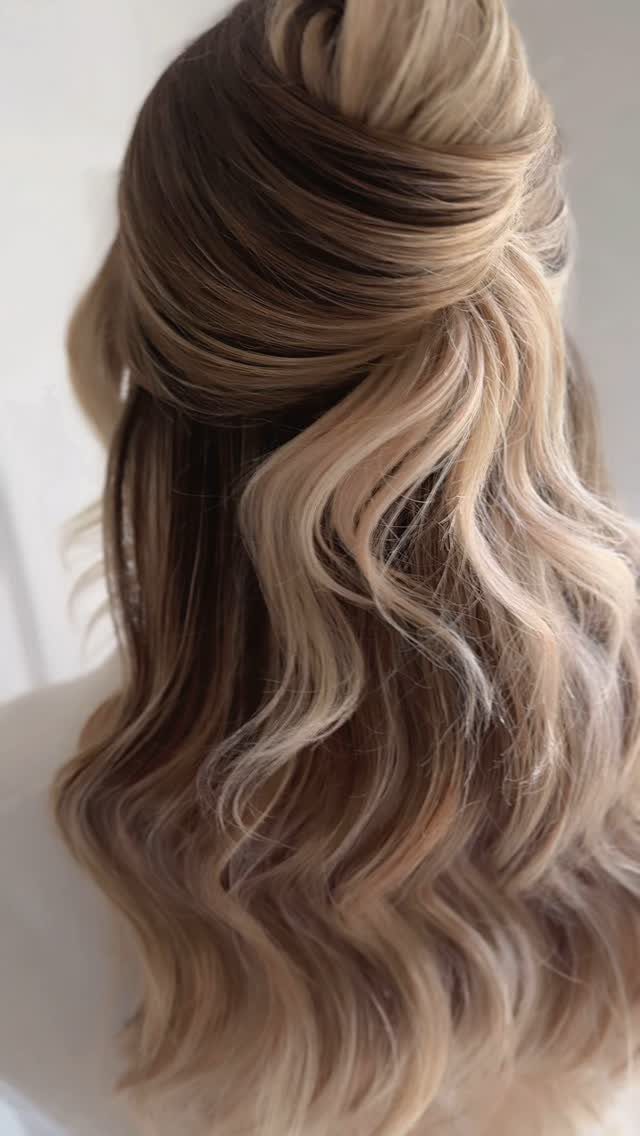 Half-up twisted brunette hair with silvery beige highlights and long soft waves