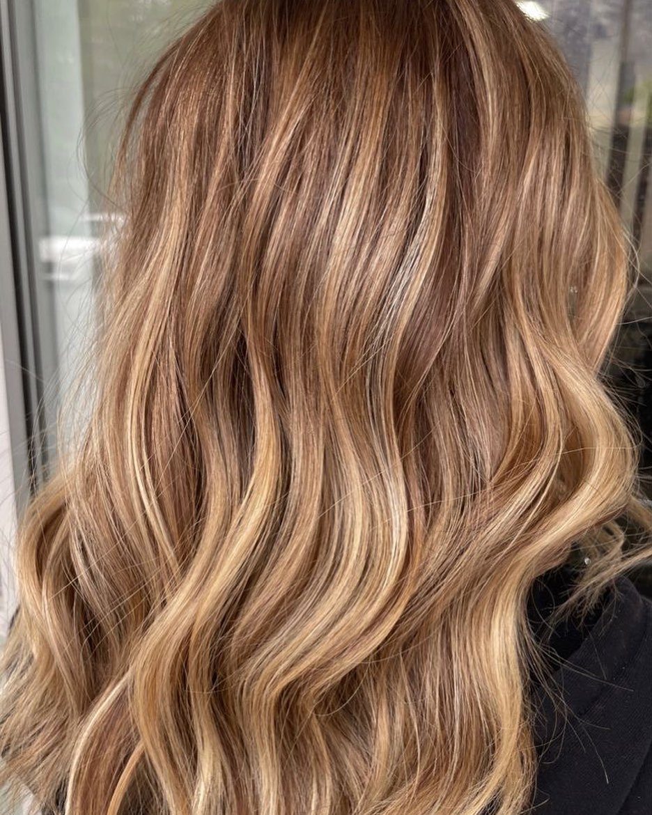 Long wavy light brown hair with fine honey and wheat highlights