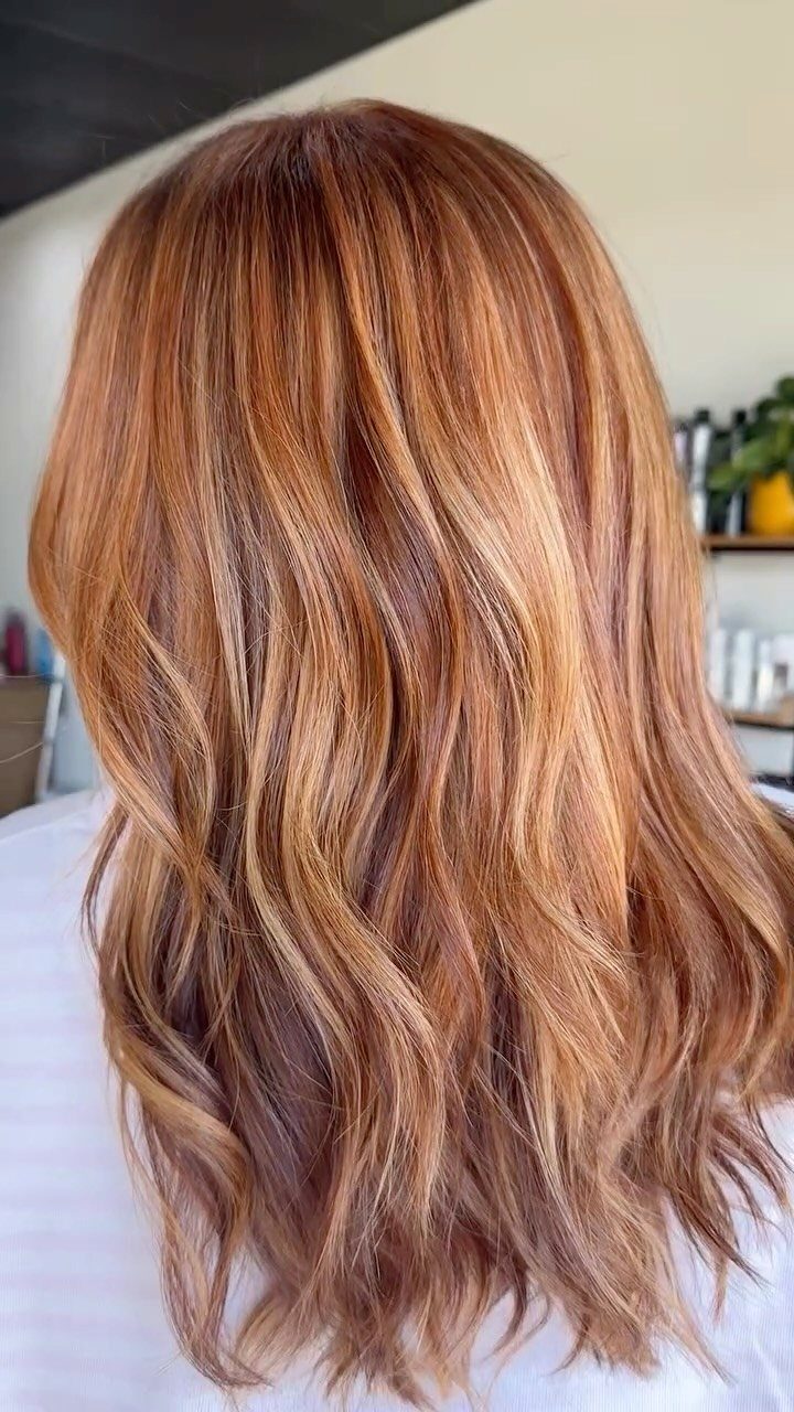 Long strawberry-blonde hair with golden highlights and darker lowlights