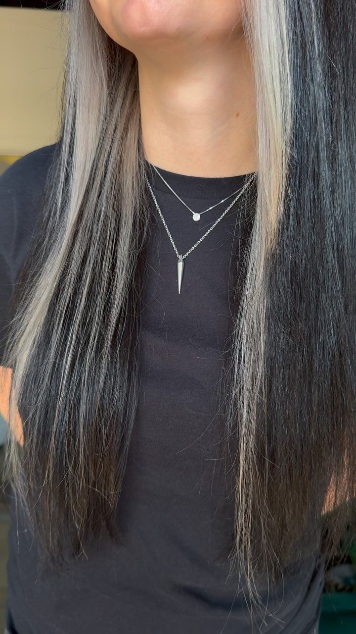 Long straight black hair with platinum-blonde face-framing sections