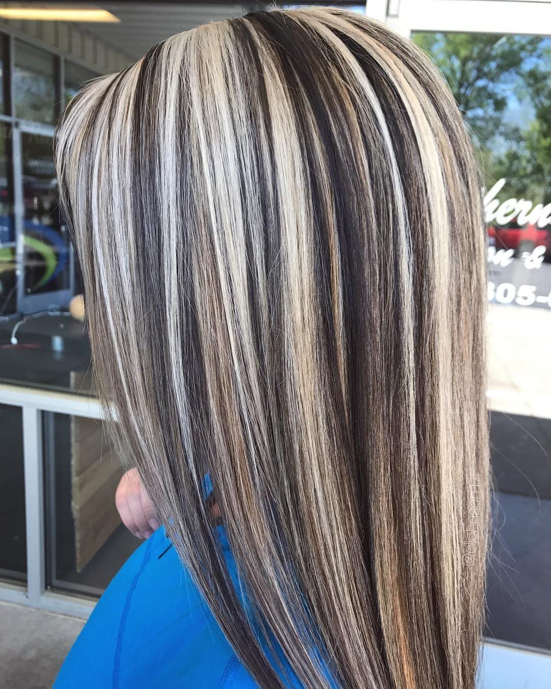 Long brown hair with fine pale blonde highlights viewed from the back