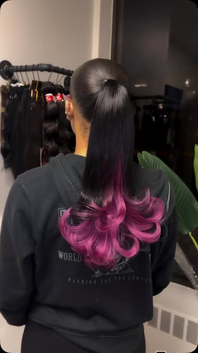 High ponytail with dark hair fading into vivid purple curled ends