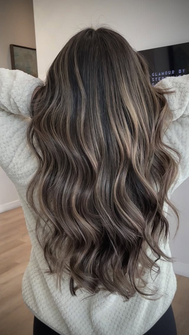 Long dark brunette waves with soft warm blonde balayage ribbons