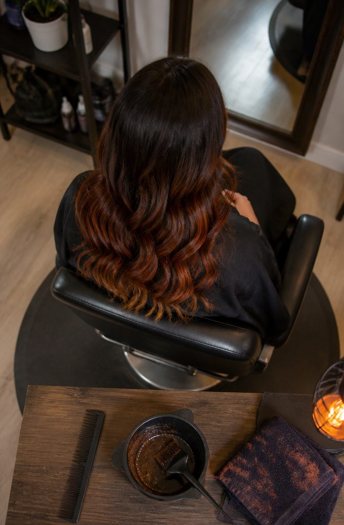 Dark brown hair with red mid-lengths and subtle gold tips
