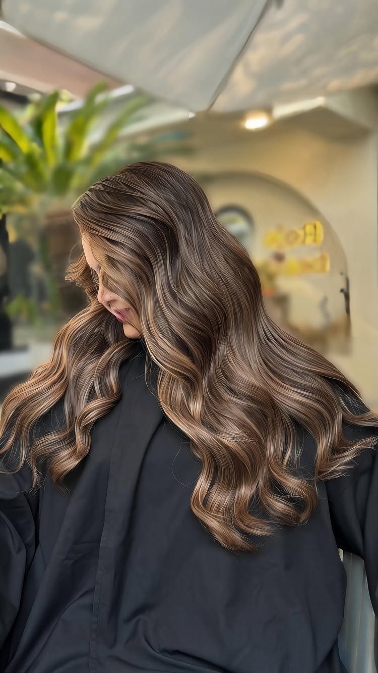 Long brunette hair with warm chestnut waves and softly lighter ends