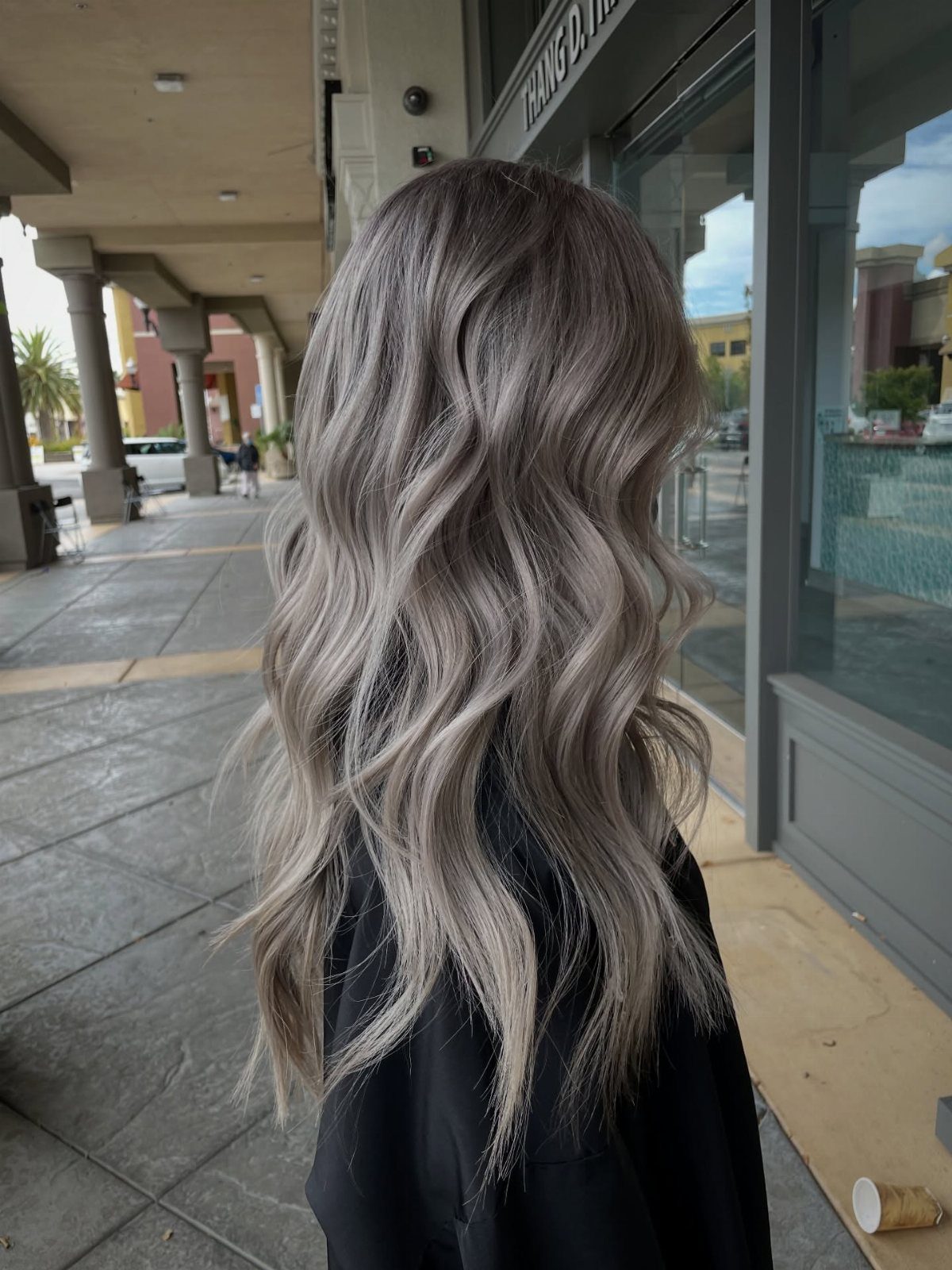 Long wavy ash blonde hair with darker lowlight strands