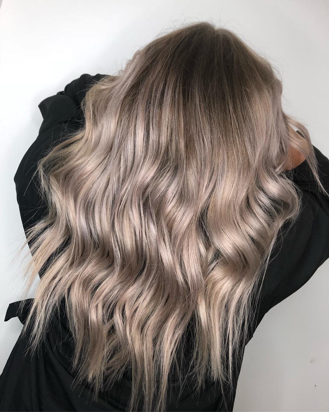 Long wavy brown hair with cool ash-blonde foilyage ribbons