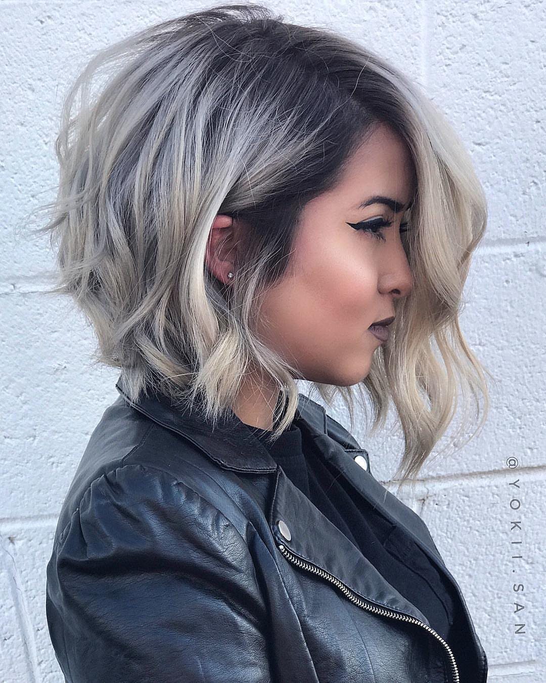 Short bob with dark roots blending into silver and blonde balayage